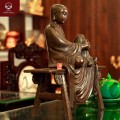 Tượng Tôn giả Mục Kiền Liên ngồi trên ghế đẩu bằng đồng hun nâu
