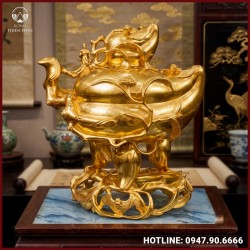 Đỉnh quả đào nằm ngang bằng đồng dát vàng